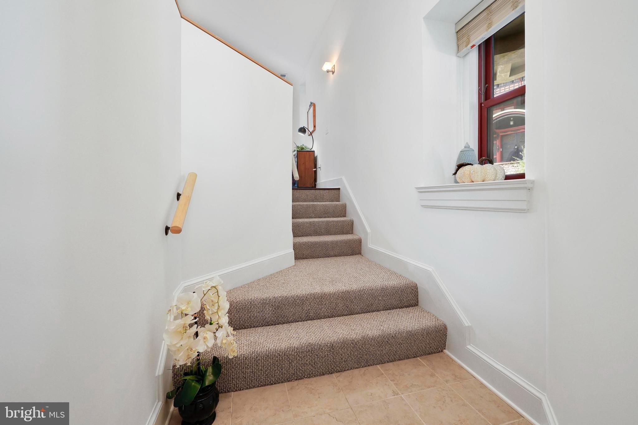 9610 Dewitt Drive, Unit BB03 Silver Spring, MD 20910 - Photo 2 of 28 a hallway with a couch