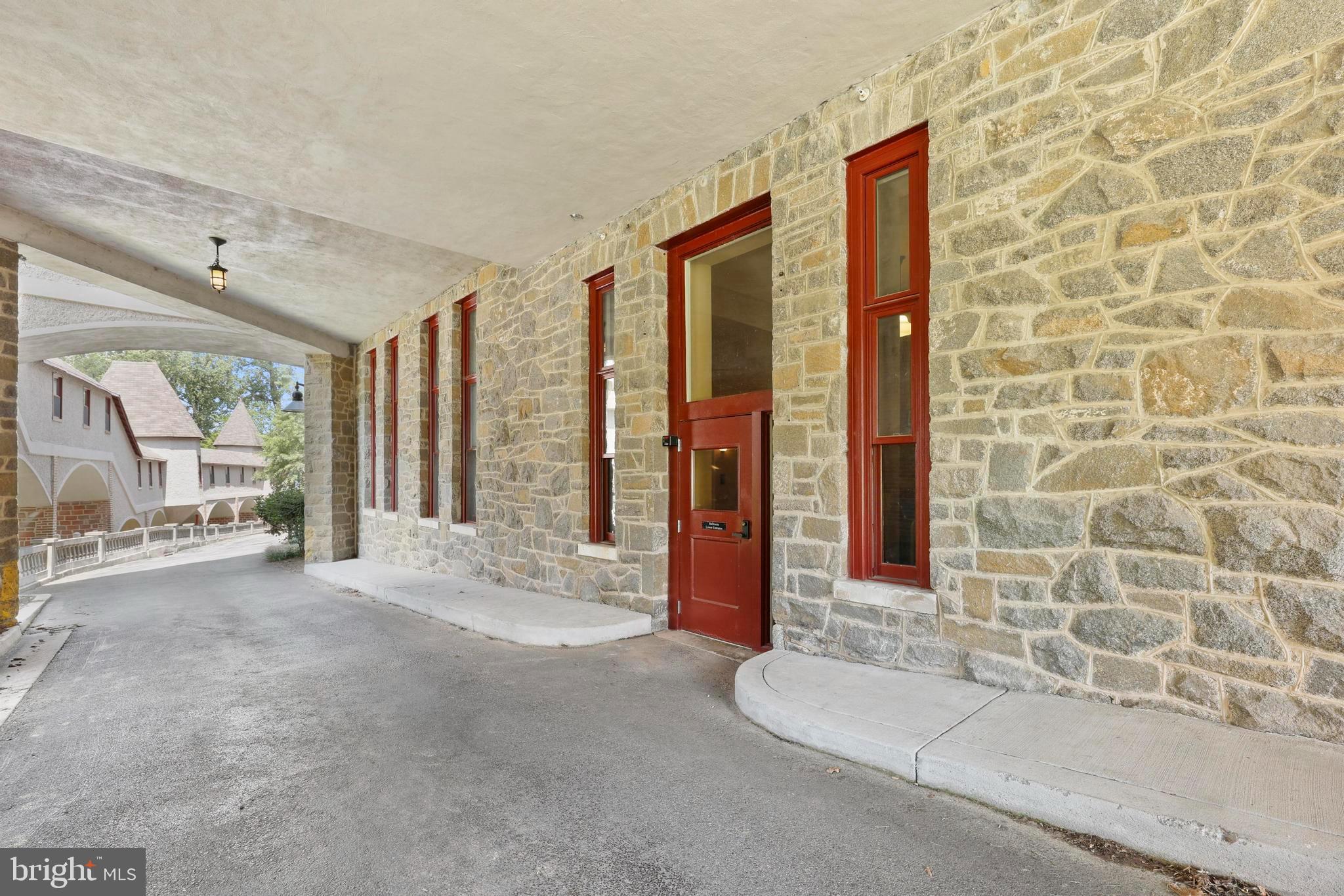 9610 Dewitt Drive, Unit BB03 Silver Spring, MD 20910 - Photo 27 of 28 a spacious bathroom with a granite countertop sink and a shower