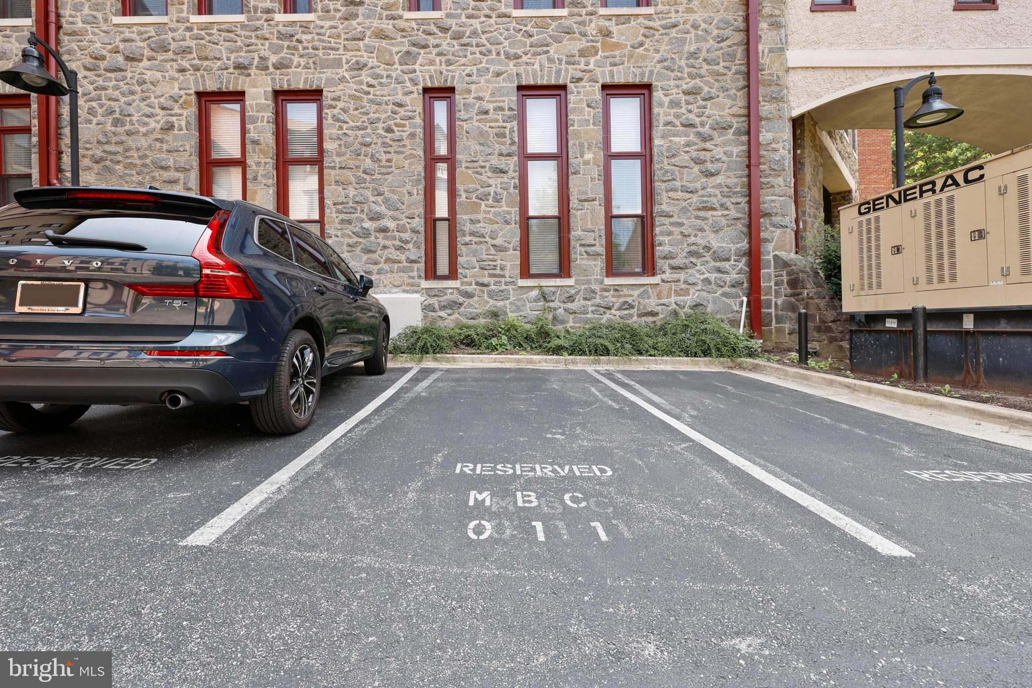 9610 Dewitt Drive, Unit BB03 Silver Spring, MD 20910 - Photo 28 of 28 a cars parked in front of a brick building