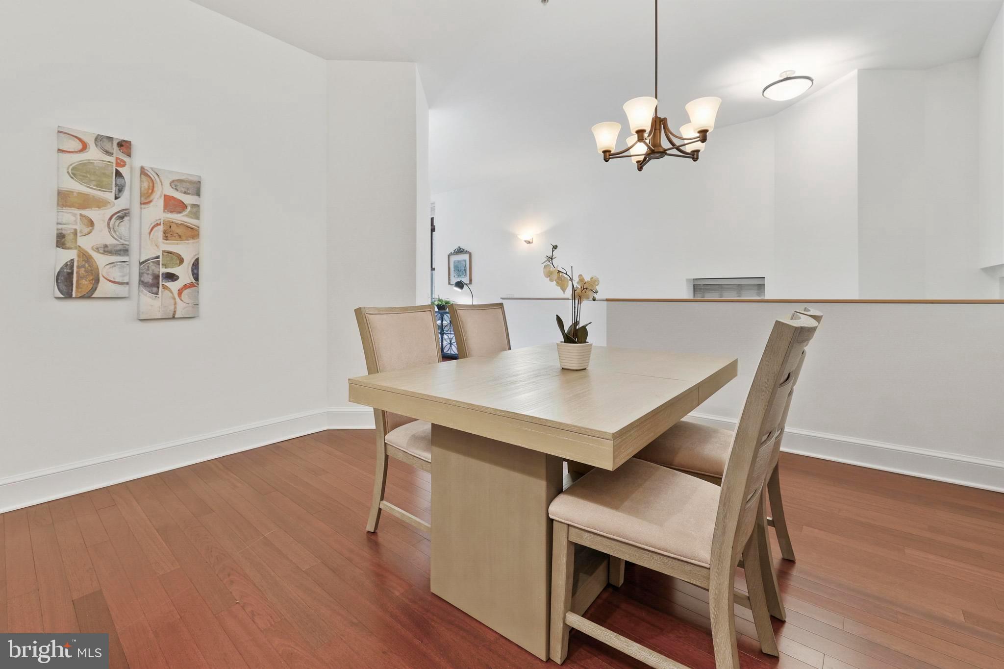 9610 Dewitt Drive, Unit BB03 Silver Spring, MD 20910 - Photo 7 of 28 a view of a dining room with furniture and wooden floor