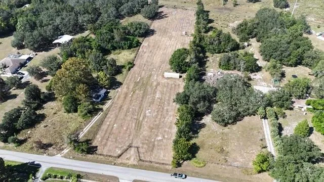 an aerial view of house with yard