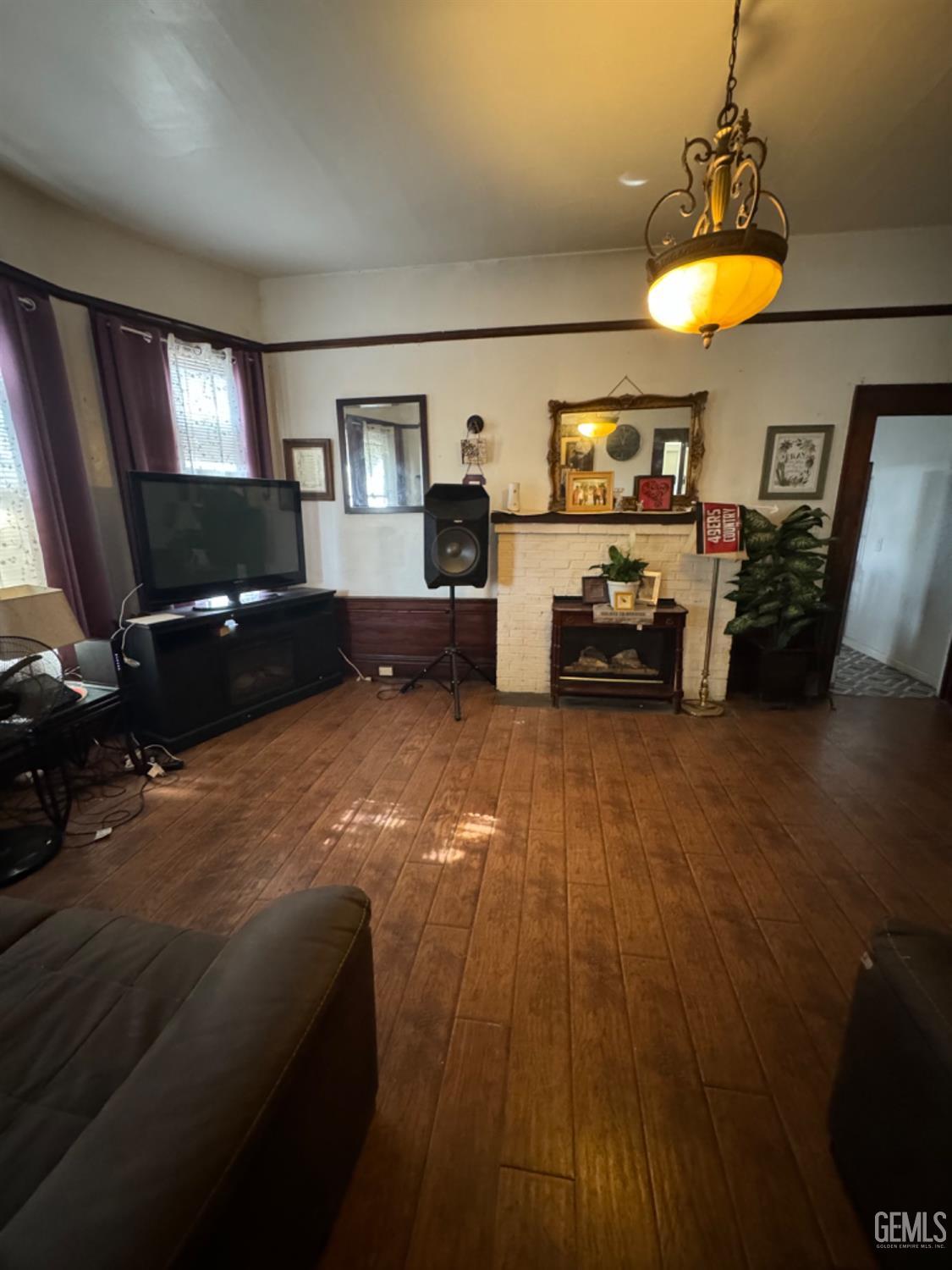 Undisclosed Address Fresno, CA 93728 - Photo 19 of 31 a living room with furniture and a flat screen tv