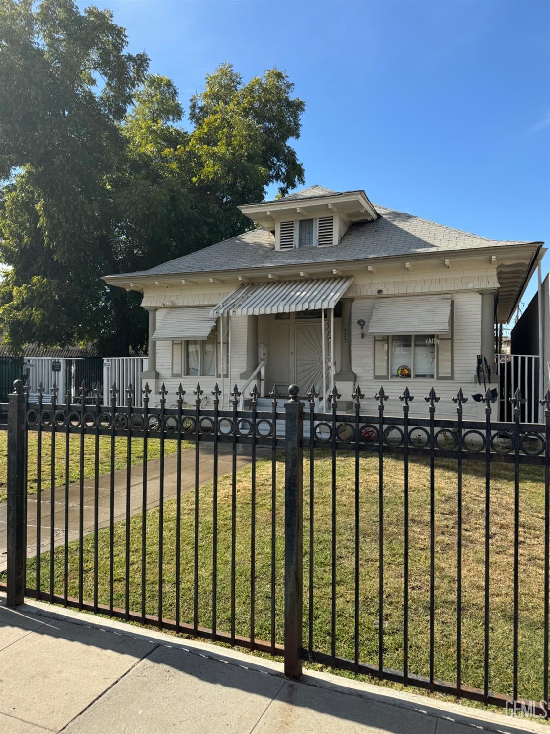 Undisclosed Address Fresno, CA 93728 - Photo 2 of 31 a front view of a house with a swimming pool
