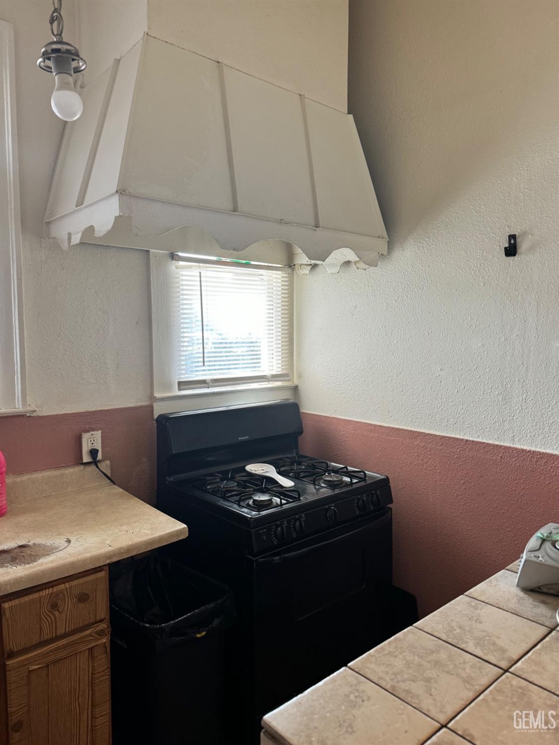 Undisclosed Address Fresno, CA 93728 - Photo 24 of 31 a kitchen with a sink cabinets and a stove top oven