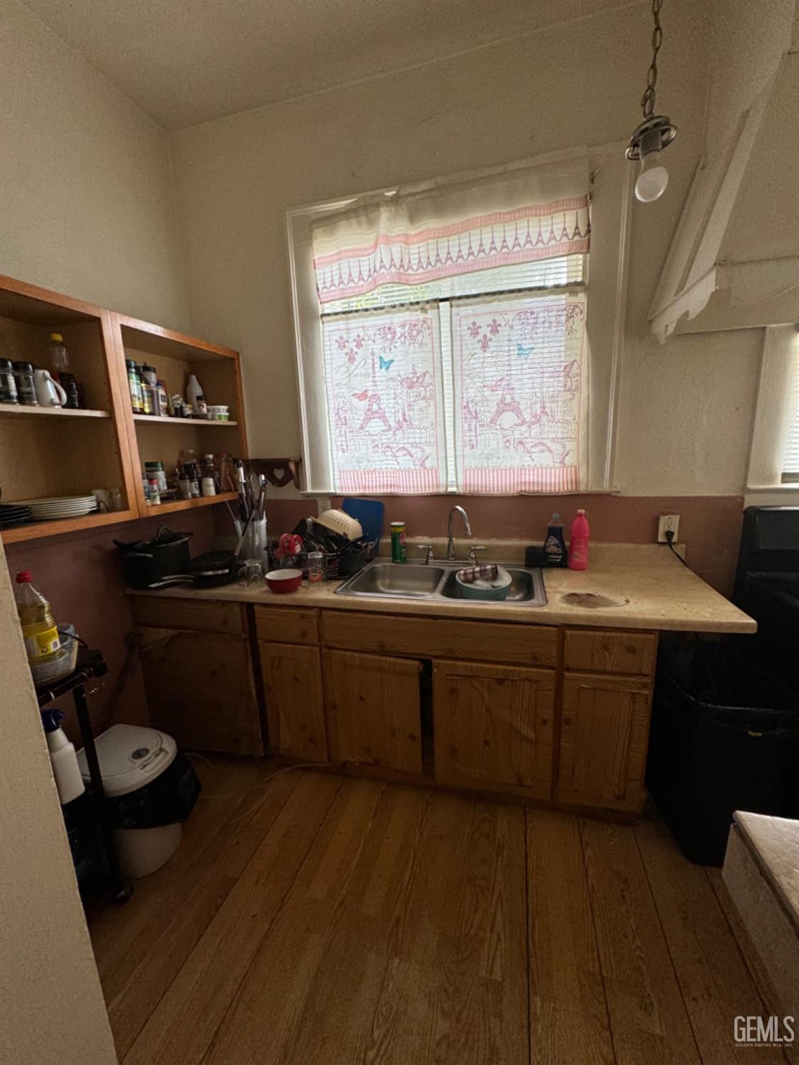 Undisclosed Address Fresno, CA 93728 - Photo 25 of 31 a kitchen with a sink stove and cabinets