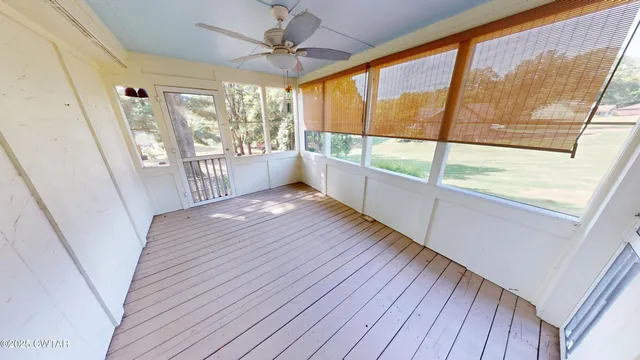 a view of an entryway with wooden floor