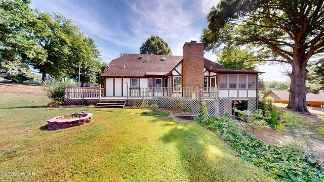 a front view of a house with swimming pool