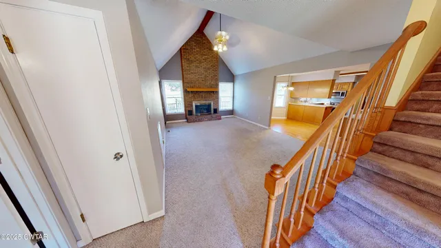a view of an entryway with wooden floor and door
