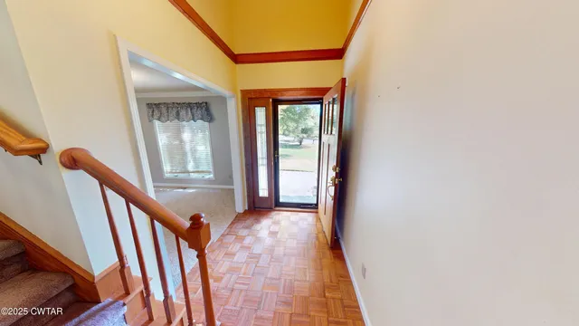 a very nice looking an entryway with wooden floor
