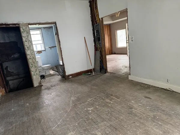 a view of a room with a washing machine and closet