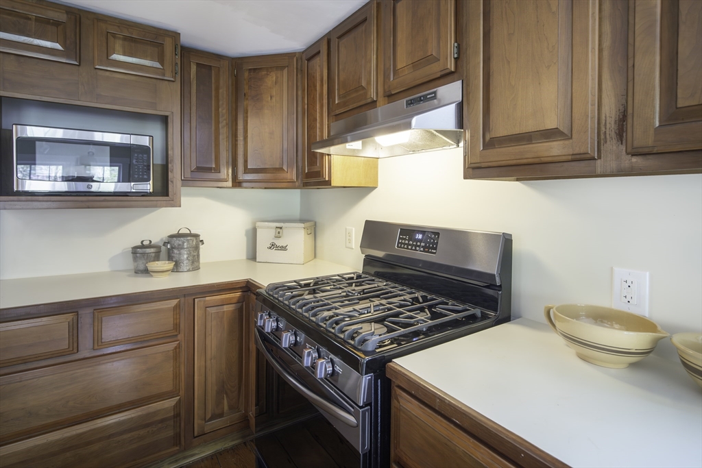 301 Cordaville Road Ashland, MA 01721 - Photo 13 of 41 a kitchen with stainless steel appliances granite countertop a stove a sink and a microwave
