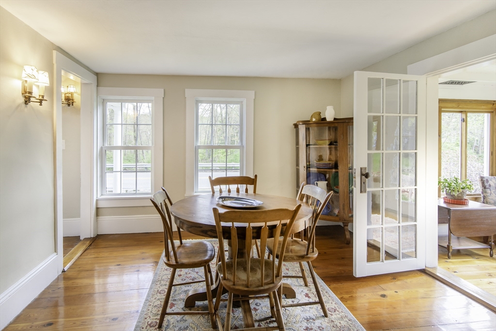 301 Cordaville Road Ashland, MA 01721 - Photo 16 of 41 a dining room with furniture and wooden floor