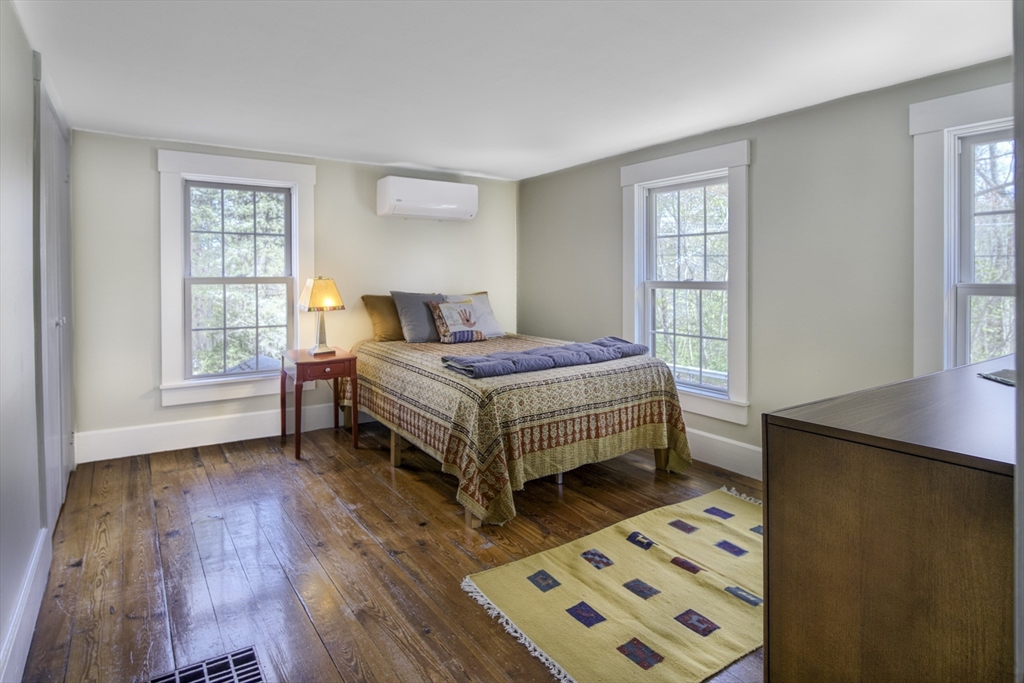 301 Cordaville Road Ashland, MA 01721 - Photo 20 of 41 a bedroom with a bed and wooden floor