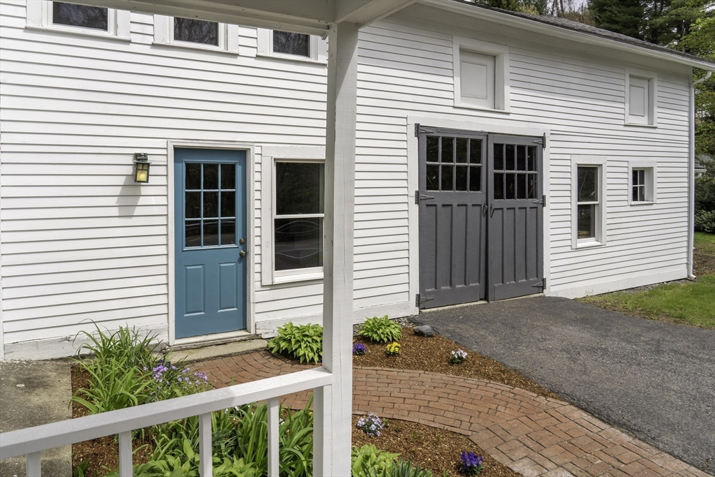 301 Cordaville Road Ashland, MA 01721 - Photo 31 of 41 a front view of a house with a yard and potted plants