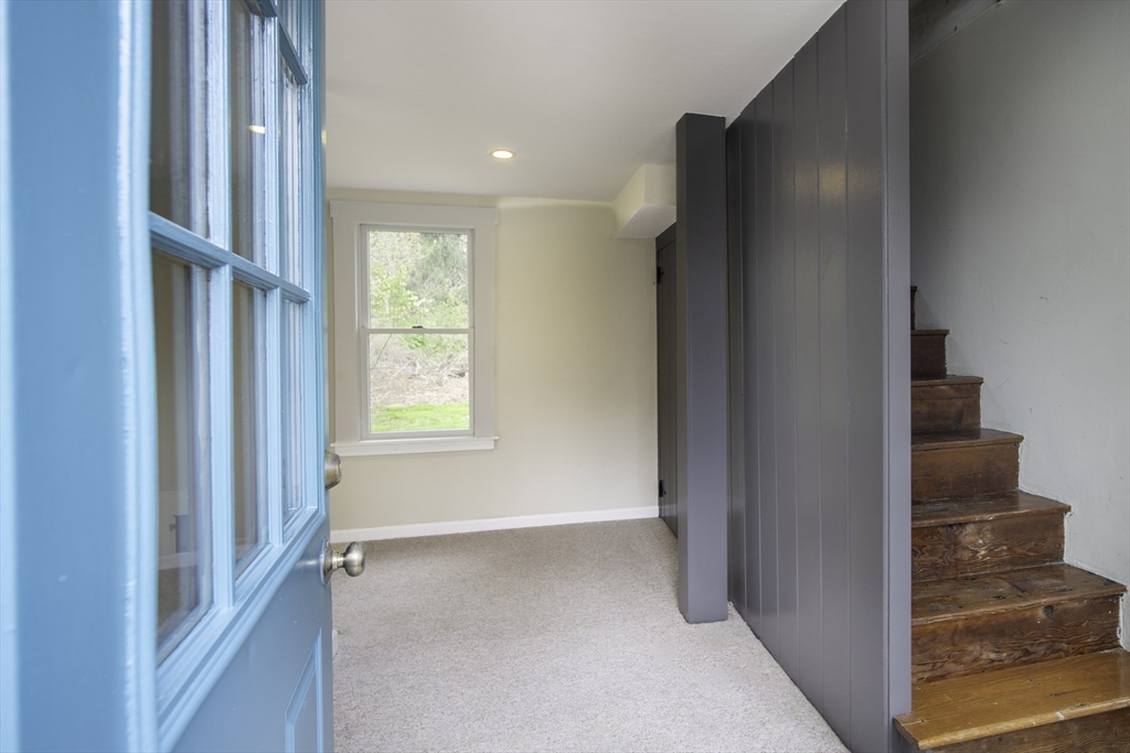 301 Cordaville Road Ashland, MA 01721 - Photo 32 of 41 a view of hallway with stairs and wooden floor
