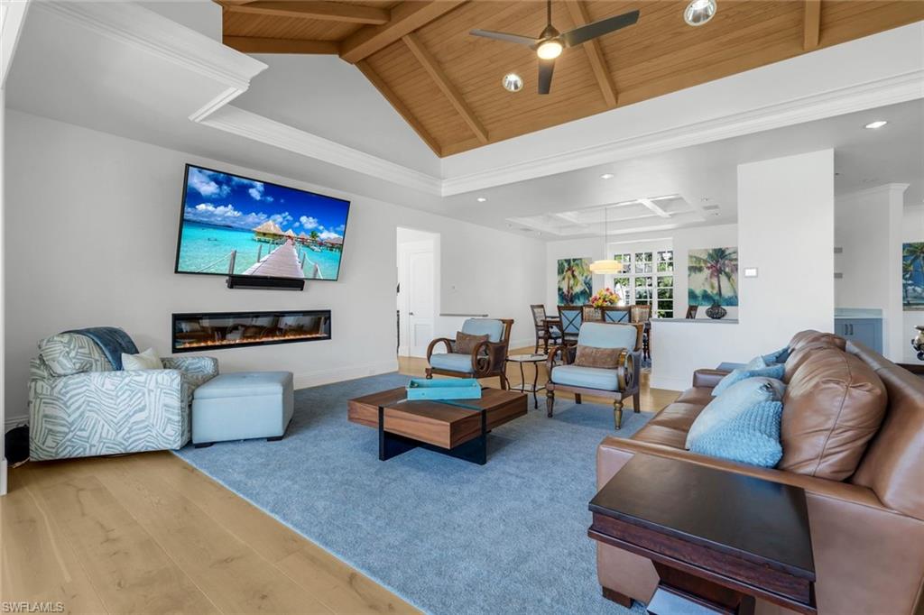 400 Springline Drive Naples, FL 34102 - Photo 9 of 37 Living area featuring wood finished floors, high vaulted ceiling, a wood ceiling with exposed beams, ceiling fan, and recessed lighting