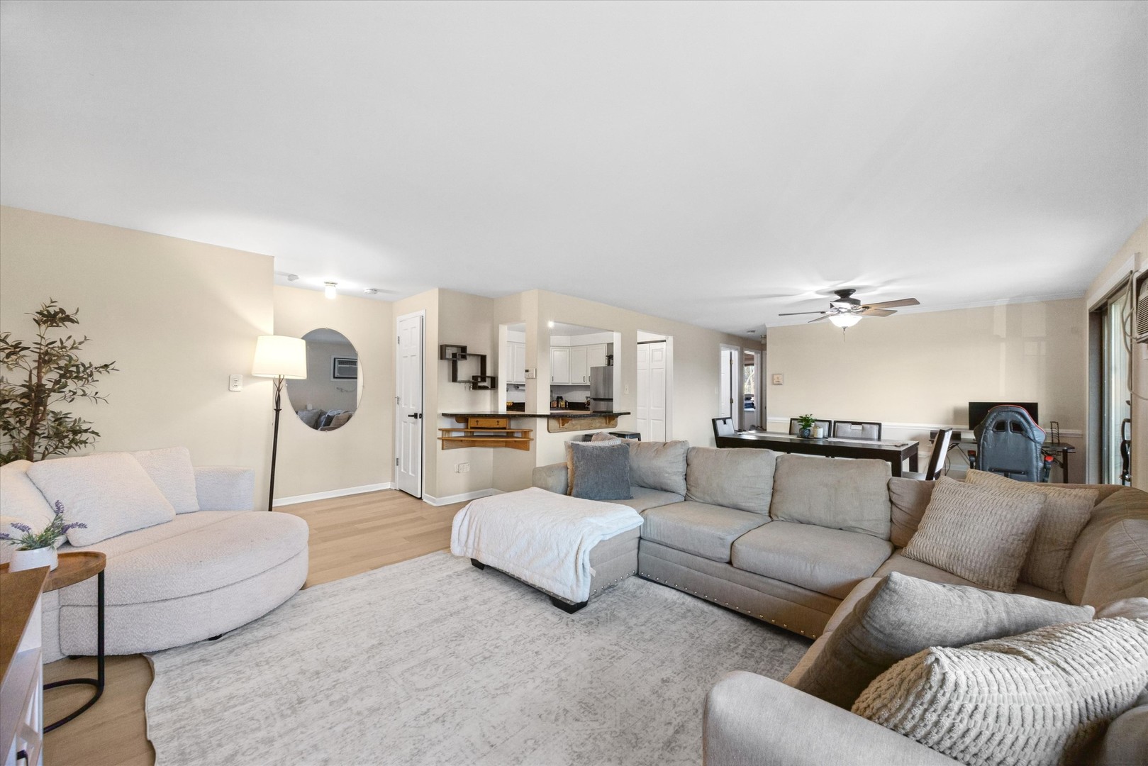 1240 South Lorraine Road, Unit 3B Wheaton, IL 60189 - Photo 2 of 17 a living room with furniture white walls and a chandelier