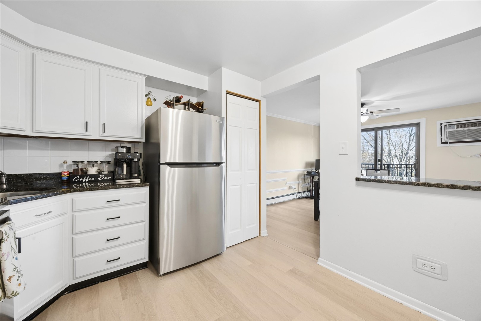 1240 South Lorraine Road, Unit 3B Wheaton, IL 60189 - Photo 7 of 17 a kitchen with appliances cabinets and a counter top space