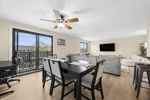 a view of a dining room with furniture window and outside view