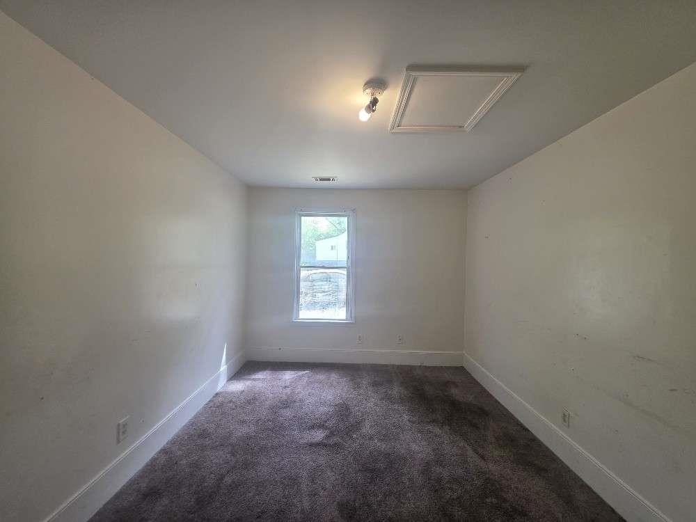 3127 Hendrix Circle Southwest Covington, GA 30014 - Photo 16 of 29 an empty room with a empty space and windows