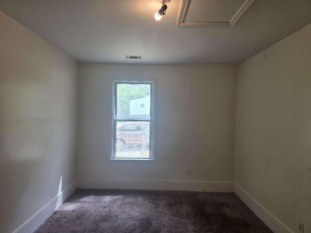 3127 Hendrix Circle Southwest Covington, GA 30014 - Photo 17 of 29 an empty room with a window