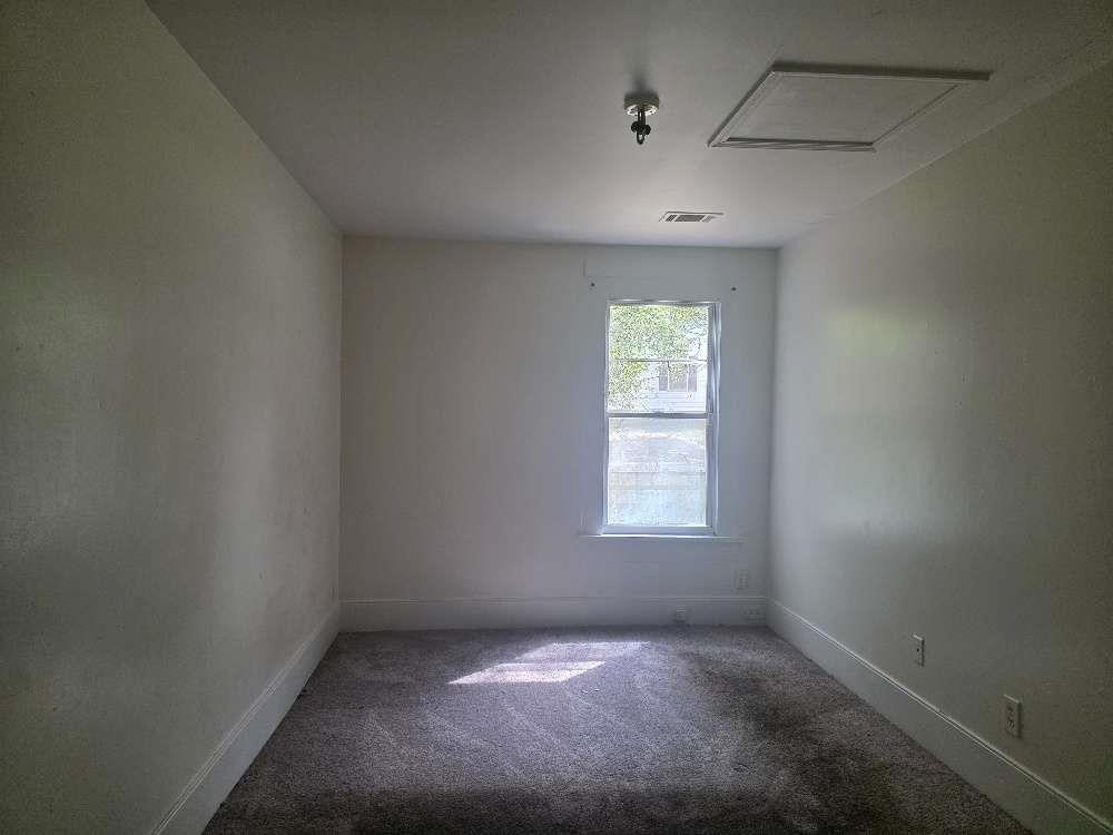 3127 Hendrix Circle Southwest Covington, GA 30014 - Photo 20 of 29 an empty room with a window