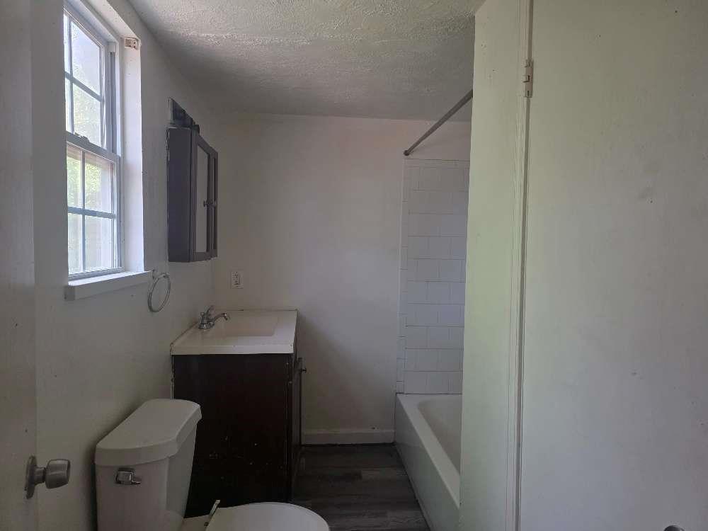 3127 Hendrix Circle Southwest Covington, GA 30014 - Photo 23 of 29 a bathroom with a toilet sink and mirror