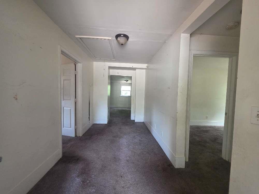3127 Hendrix Circle Southwest Covington, GA 30014 - Photo 5 of 29 a view of a hallway with wooden shelves