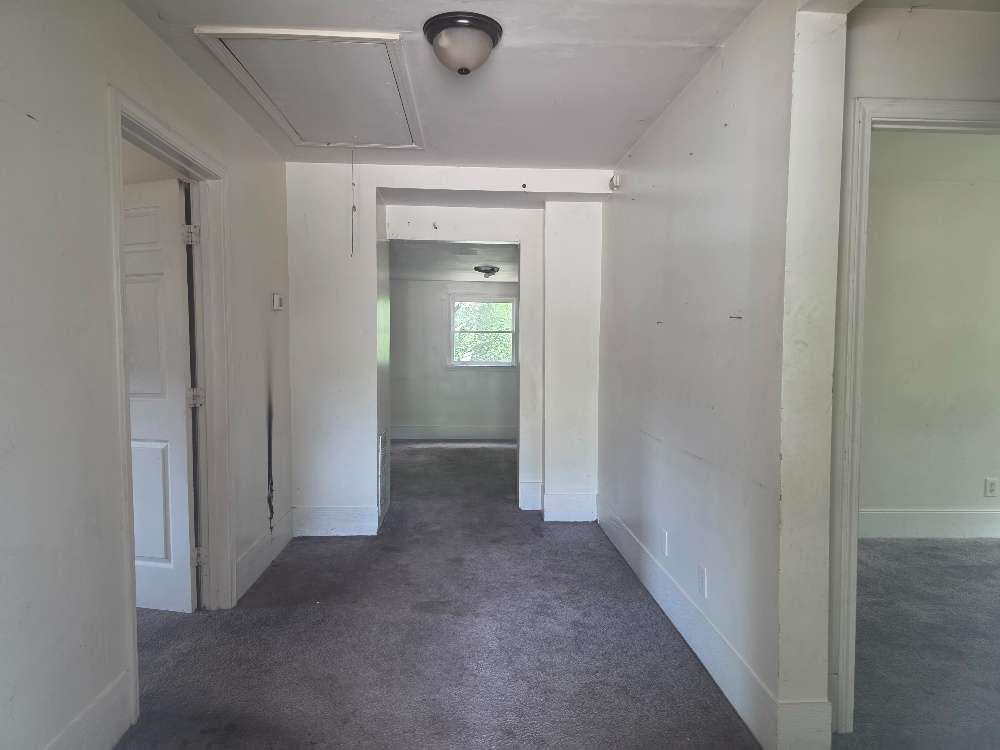 3127 Hendrix Circle Southwest Covington, GA 30014 - Photo 6 of 29 a view of a hallway with wooden shelves