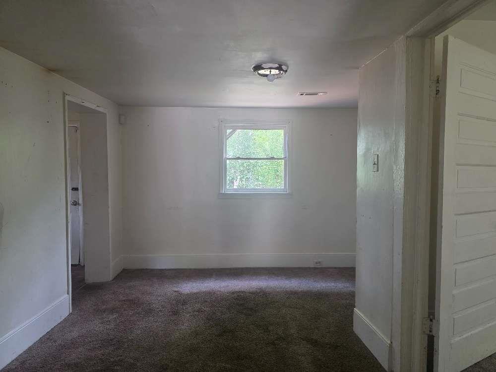 3127 Hendrix Circle Southwest Covington, GA 30014 - Photo 9 of 29 an empty room with windows