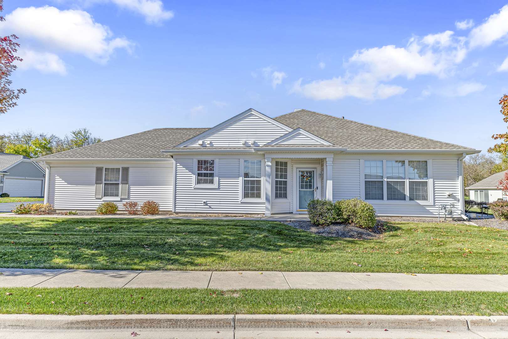 a front view of a house with a yard