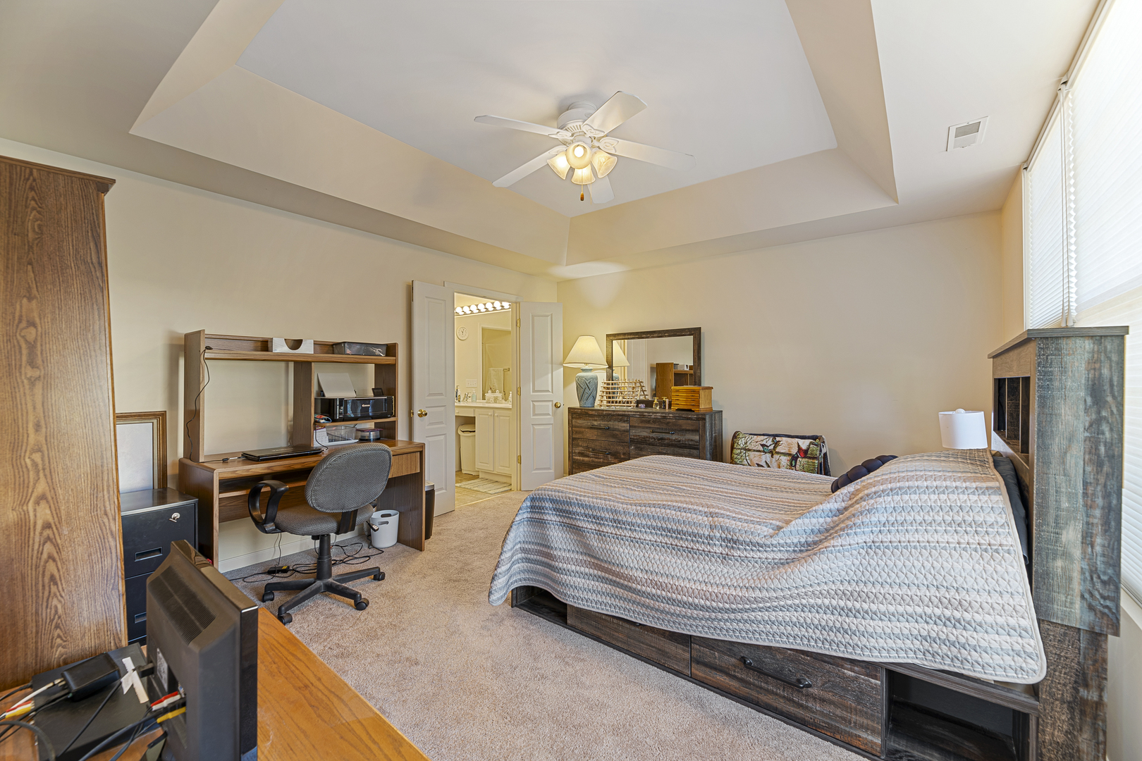 12963 Penefield Lane Huntley, IL 60142 - Photo 12 of 33 a bedroom with a bed a computer on the desk and a dresser