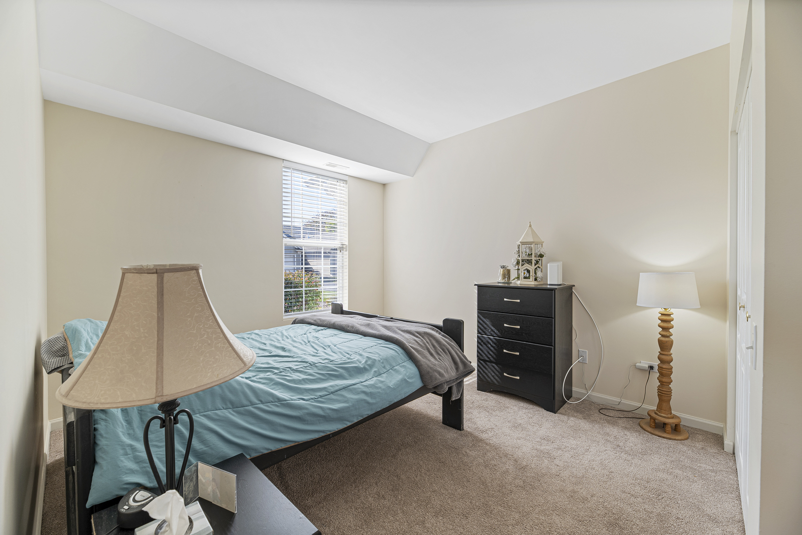 12963 Penefield Lane Huntley, IL 60142 - Photo 15 of 33 a bedroom with a bed and a dresser