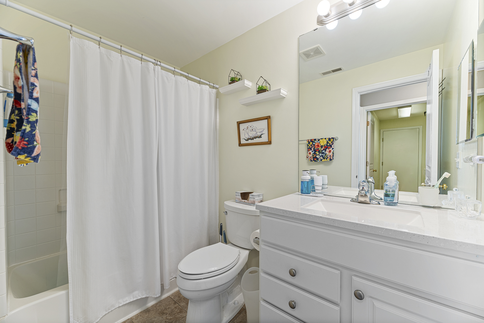 12963 Penefield Lane Huntley, IL 60142 - Photo 16 of 33 a bathroom with a sink a toilet and shower curtain