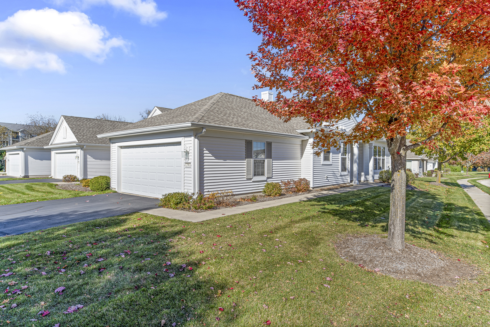 12963 Penefield Lane Huntley, IL 60142 - Photo 18 of 33 a front view of a house with garden