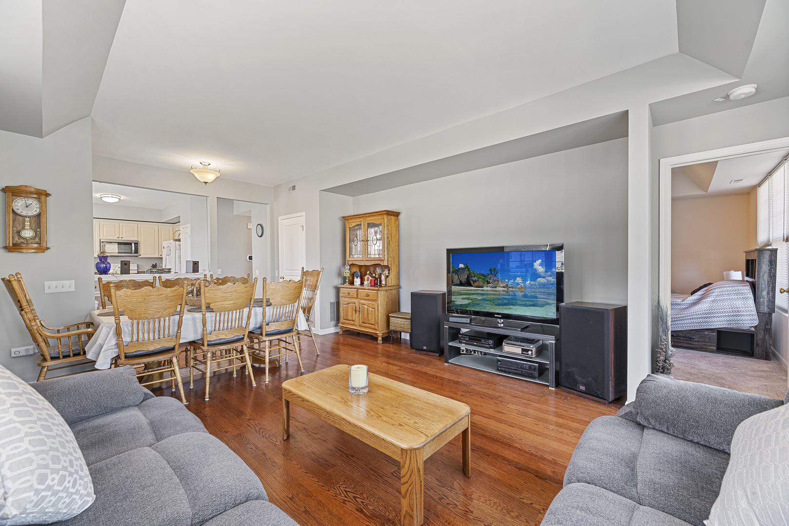 12963 Penefield Lane Huntley, IL 60142 - Photo 5 of 33 a living room with furniture and a flat screen tv