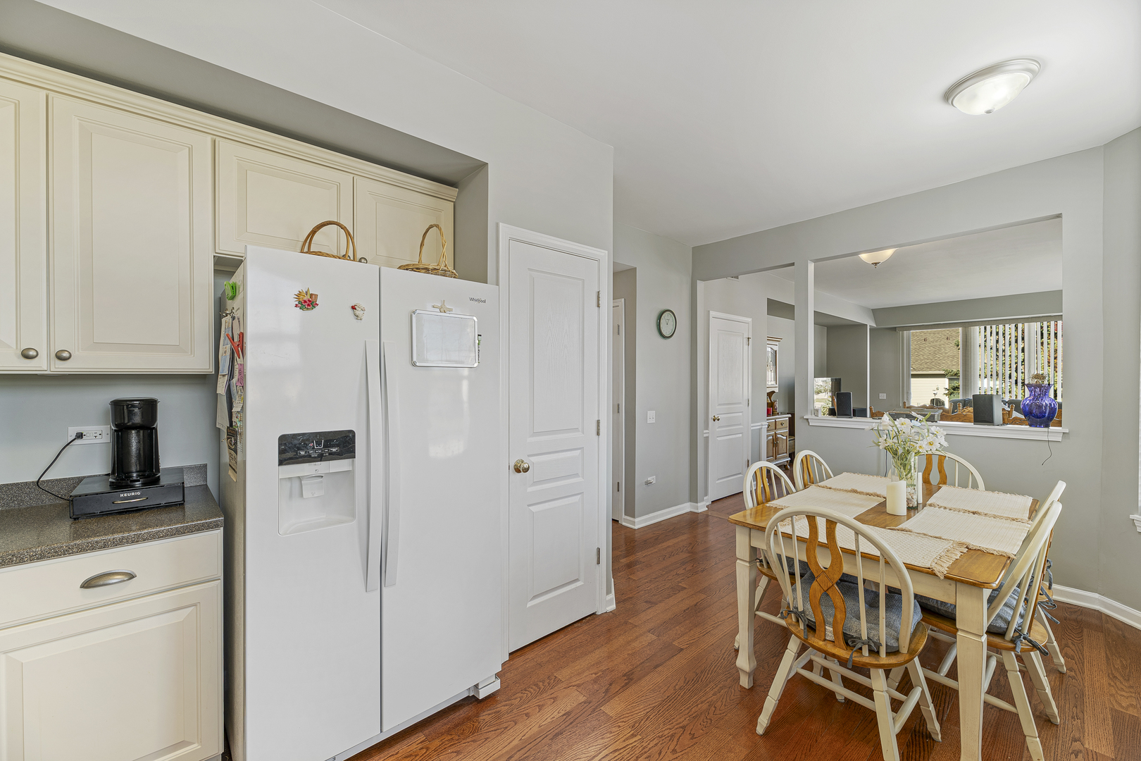 12963 Penefield Lane Huntley, IL 60142 - Photo 6 of 33 a view of a dining room with furniture and wooden floor