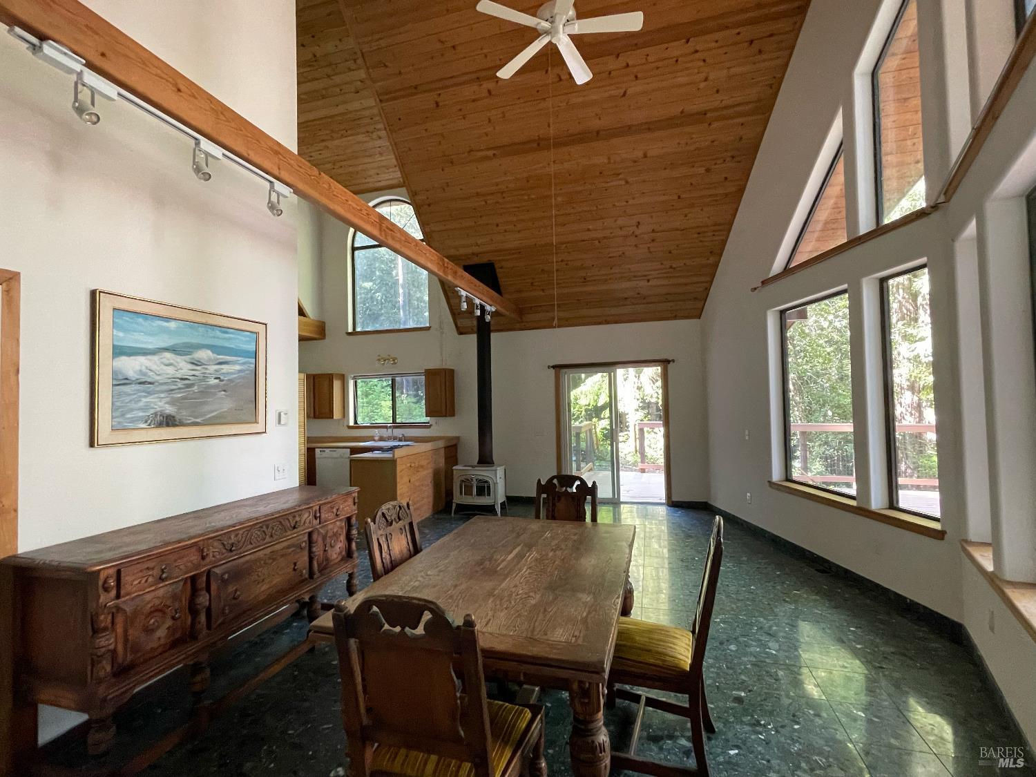 35905 Hauser Bridge Road, Unit J Cazadero, CA 95421 - Photo 14 of 34 Dining area in great room/living room... with cathedral wood ceilings, many view windows!