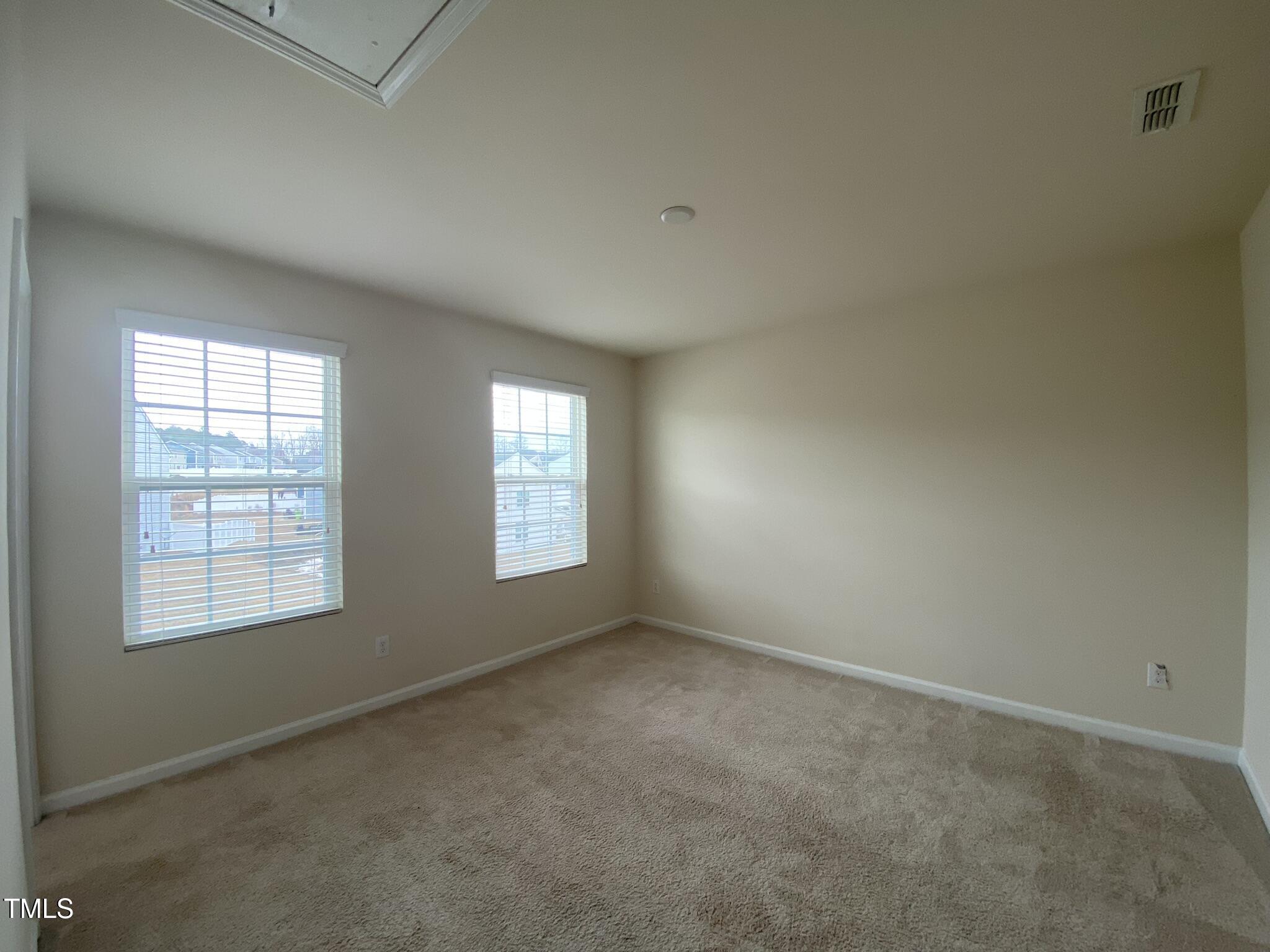 3545 Massey Ridge Court Raleigh, NC 27616 - Photo 19 of 38 an empty room with windows