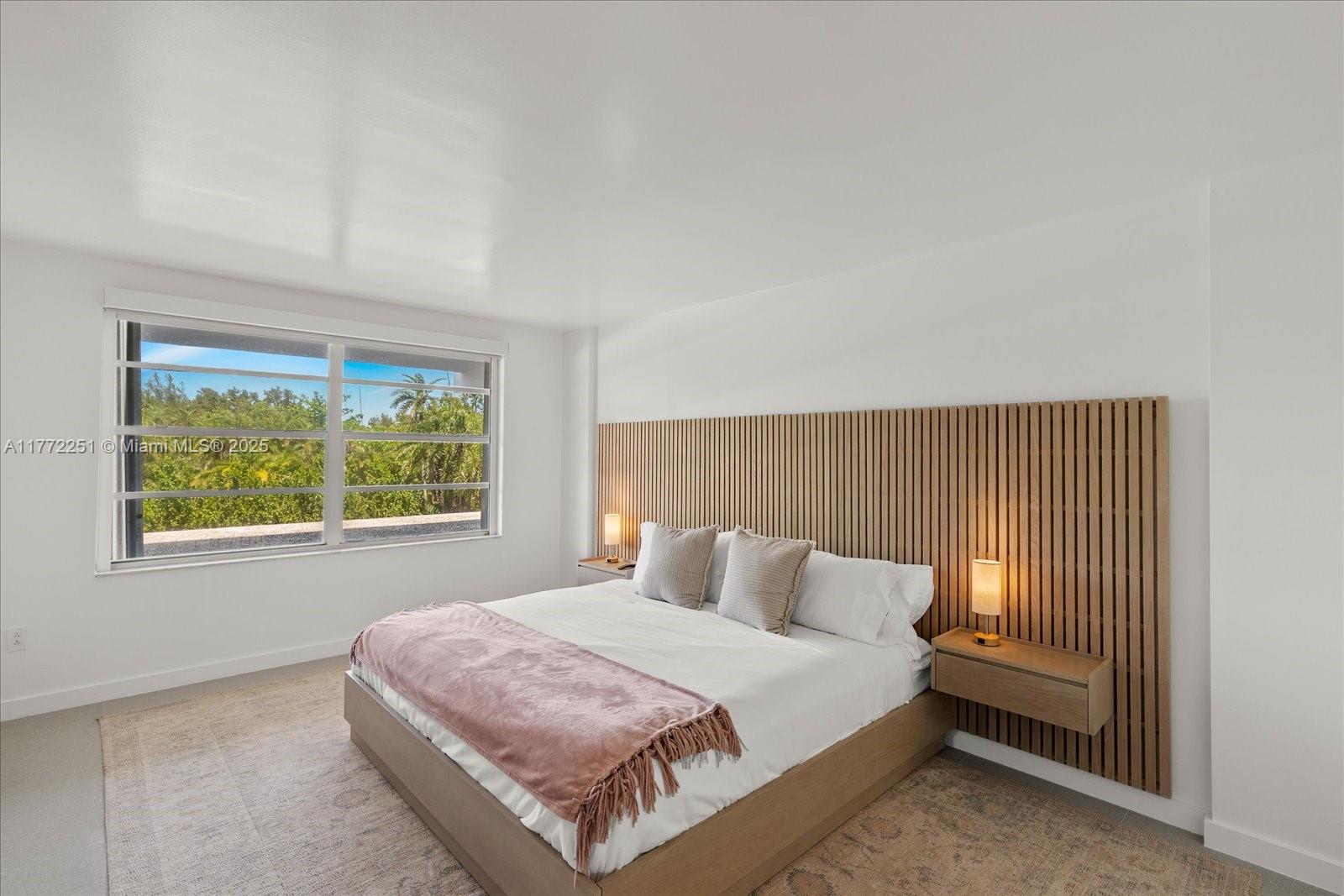 155 Ocean Ln Drive, Unit 208 Key Biscayne, FL 33149 - Photo 12 of 34 a bedroom with a bed and window