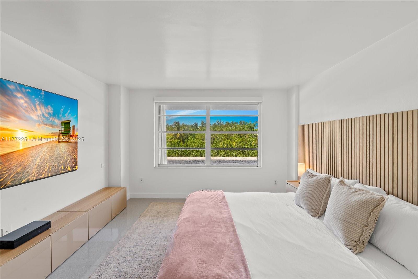 155 Ocean Ln Drive, Unit 208 Key Biscayne, FL 33149 - Photo 13 of 34 a bed sitting in a bedroom next to a window