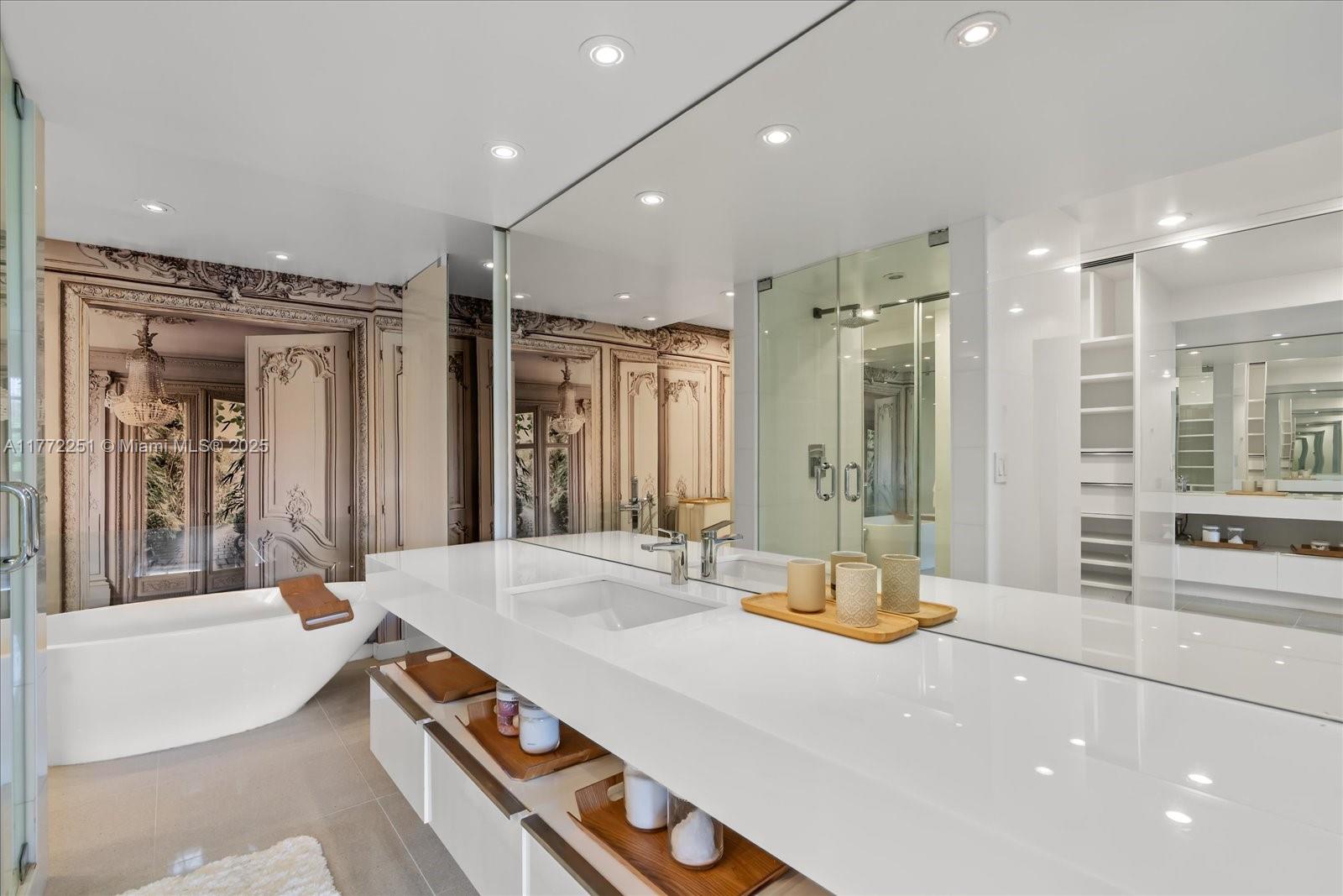 155 Ocean Ln Drive, Unit 208 Key Biscayne, FL 33149 - Photo 16 of 34 a large bathroom with a large tub and shower