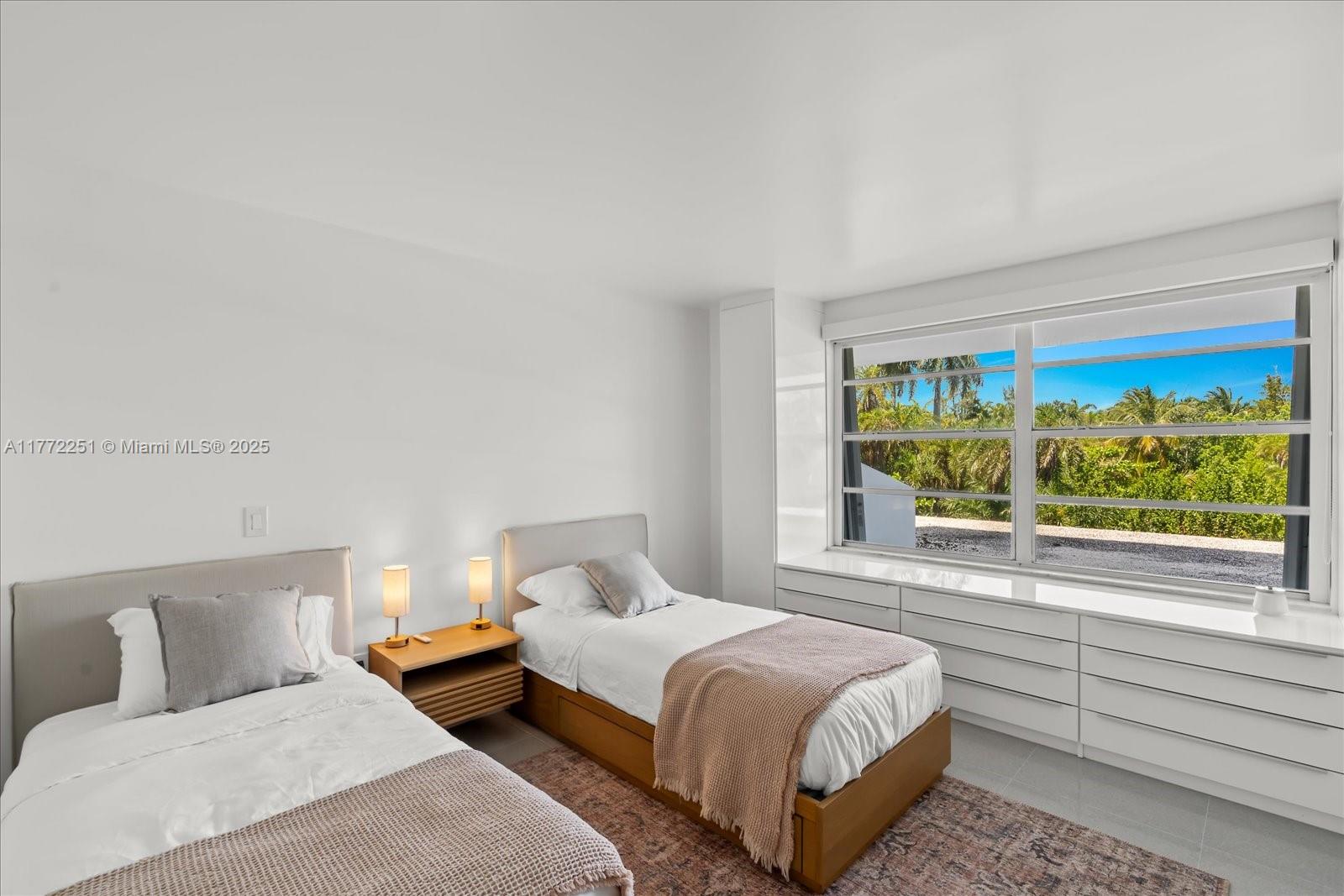 155 Ocean Ln Drive, Unit 208 Key Biscayne, FL 33149 - Photo 19 of 34 a bedroom with a bed and large window