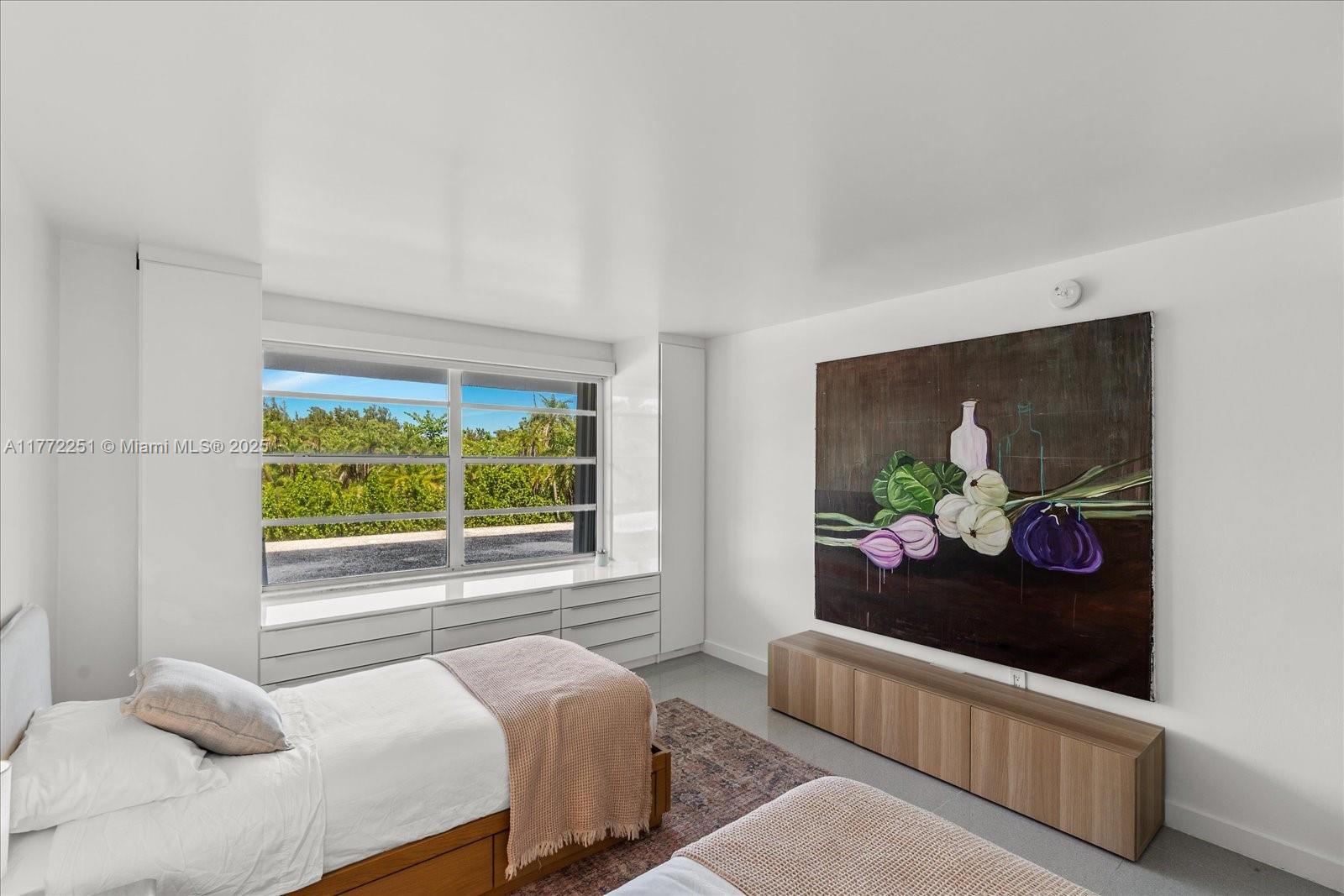 155 Ocean Ln Drive, Unit 208 Key Biscayne, FL 33149 - Photo 20 of 34 a bedroom with a bed and a window