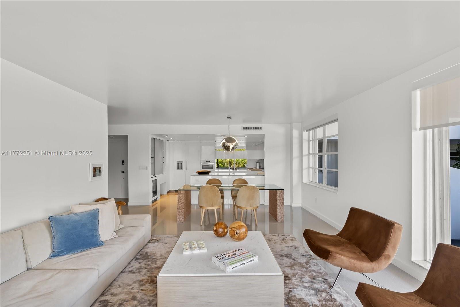 155 Ocean Ln Drive, Unit 208 Key Biscayne, FL 33149 - Photo 4 of 34 a living room with furniture and a wooden floor