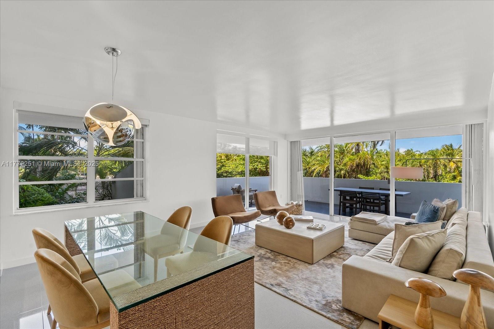 155 Ocean Ln Drive, Unit 208 Key Biscayne, FL 33149 - Photo 5 of 34 a living room with fireplace furniture and a floor to ceiling window