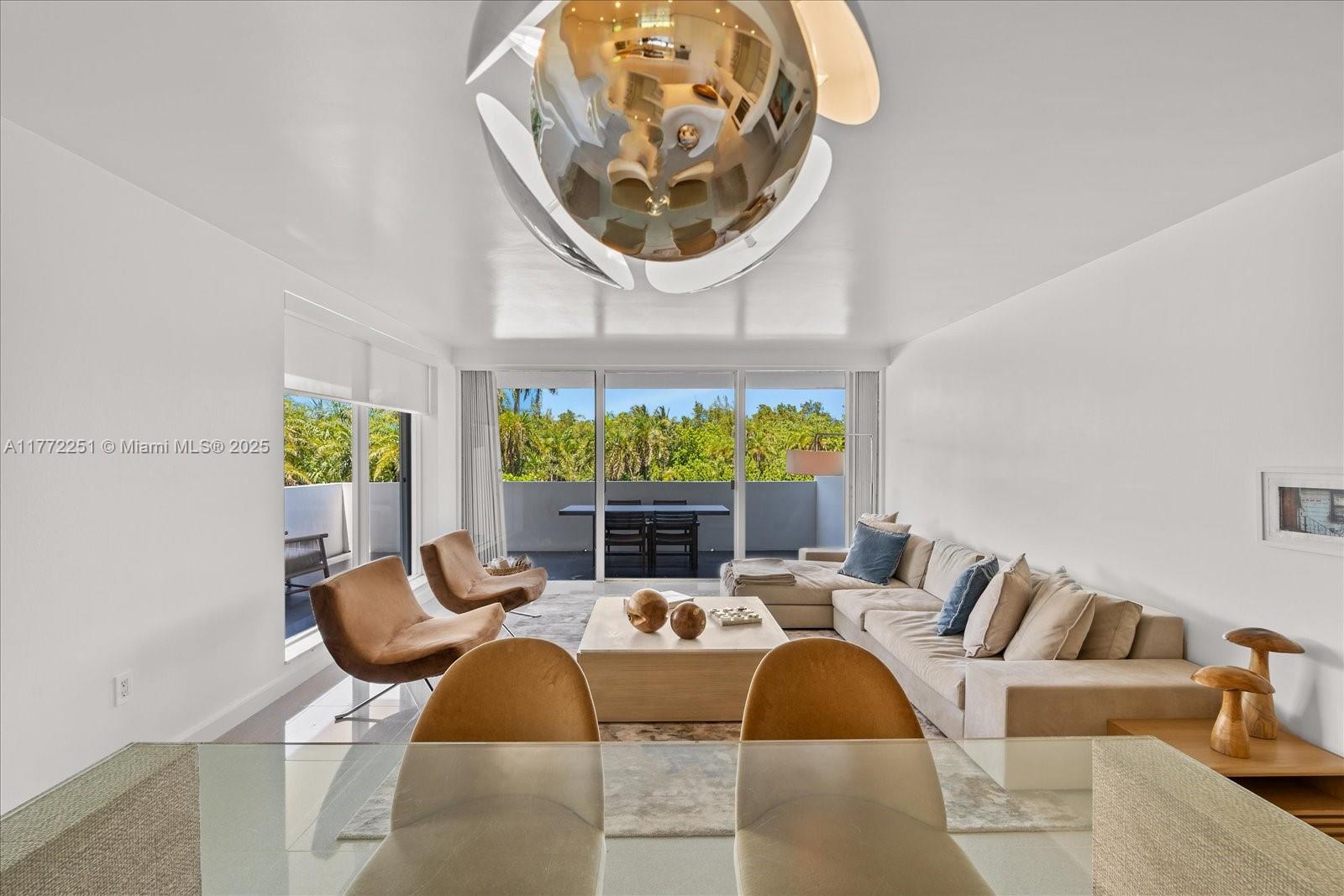 155 Ocean Ln Drive, Unit 208 Key Biscayne, FL 33149 - Photo 6 of 34 a living room with furniture and a large window