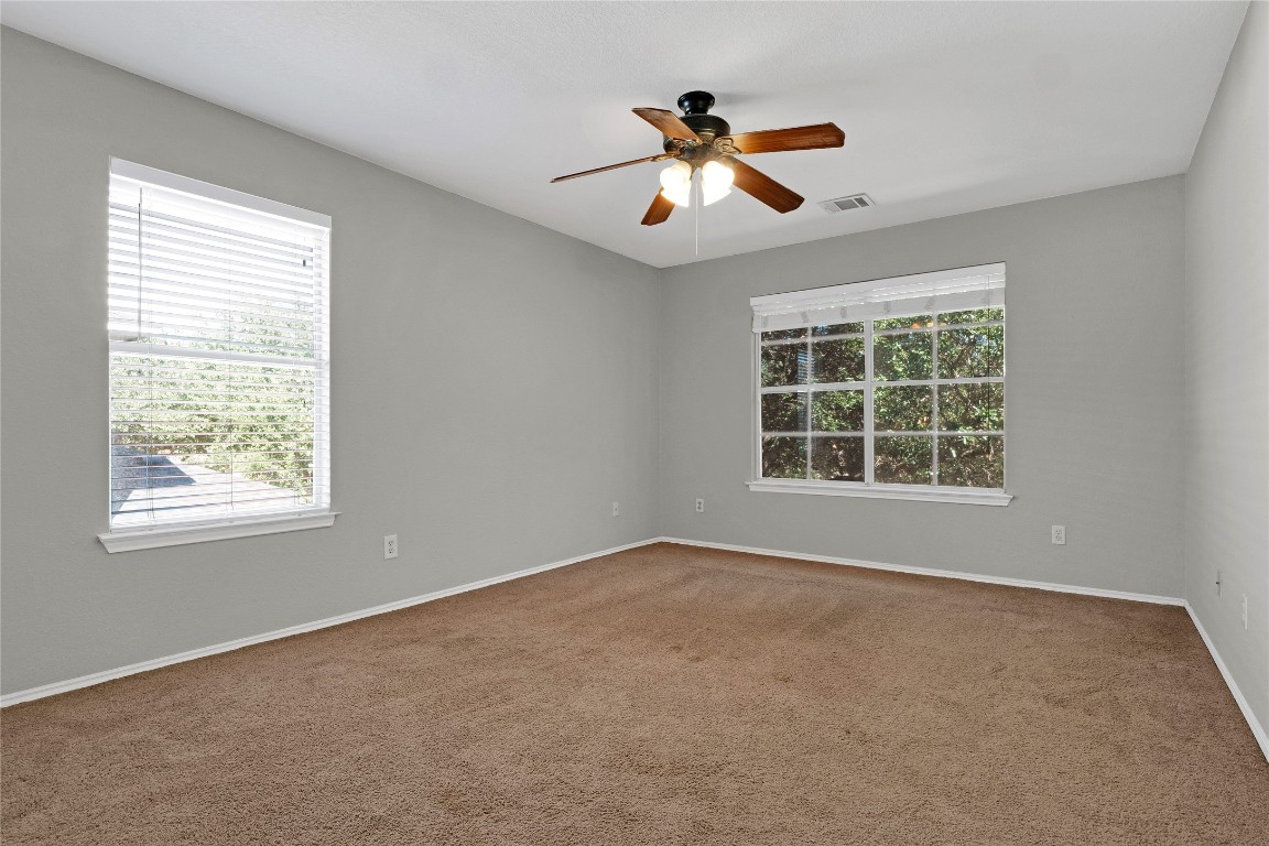 3007 Rainy River Drive Leander, TX 78641 - Photo 14 of 34 Primary bedroom featuring carpet and a ceiling fan