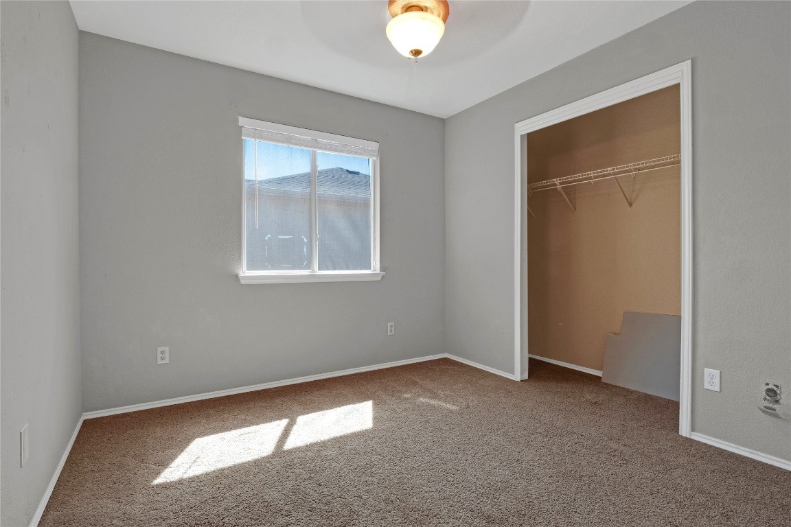 3007 Rainy River Drive Leander, TX 78641 - Photo 17 of 34 Bedroom #2 with baseboards and a closet