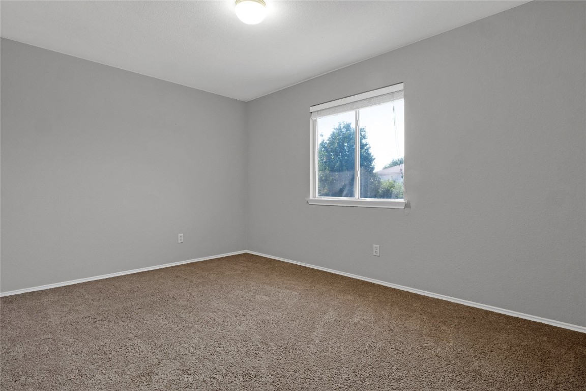 3007 Rainy River Drive Leander, TX 78641 - Photo 19 of 34 Bedroom #3 with carpet and baseboards